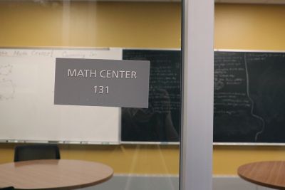 The Math Center, with a sign on the glass doorway