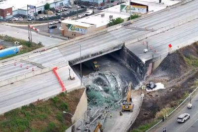 An aerial shot shows a portion of I-95 that collapsed. 
