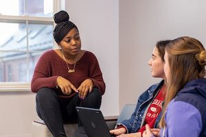 Resident Assistant with students in residence hall
