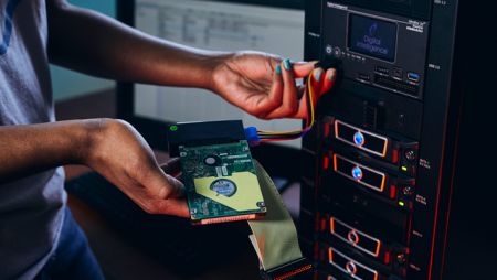 Computer science student with computer chip in lab