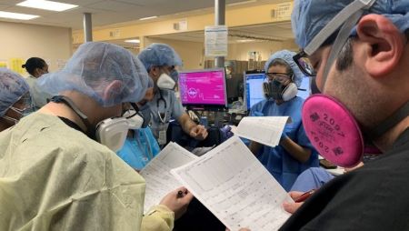 health care workers in a hospital wearing protective gear