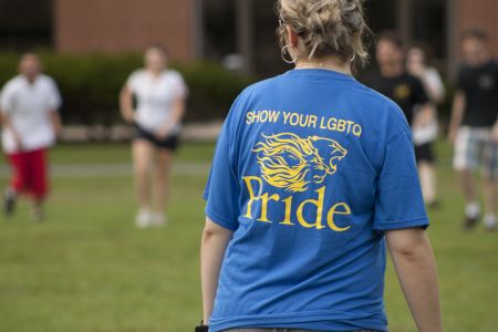 Person wearing a 'Show Your LGBTQ Pride' shirt