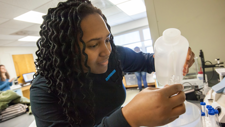 School of Engineering student mixing chemicals in lab. Widener University is considered one of the top schools for engineering and offers degrees across many engineering fields.