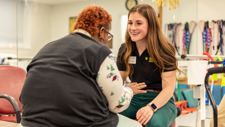 Physical therapy student working with client in Chester Community Clinic