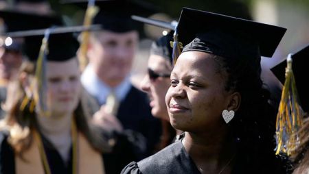 Adult student looking into the distance during Widener commencement ceremony
