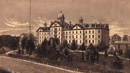 Historic image of front of Old Main in sepia tones