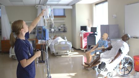 Widener University School of Nursing bachelor's of nursing student works in healthcare simulation lab