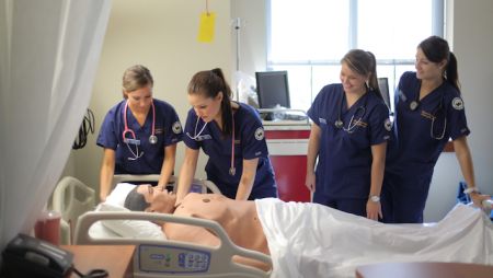 Widener's nursing students practicing in simulation lab.