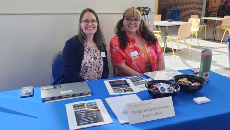 Dean Grimm and a student worker at the campus job fair