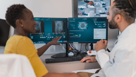 Medical imaging professionals look at an X-ray.