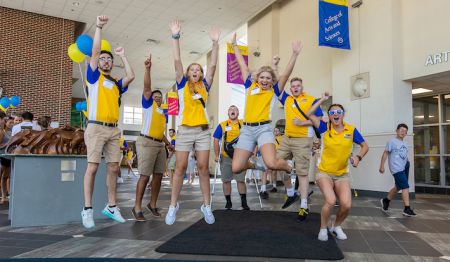 The Widener CREW leaders team shares a fun mid-jump moment at an admissions event.