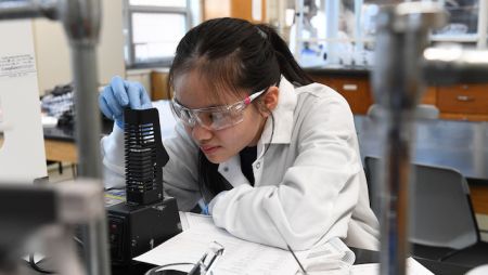 Widener University chemical engineering student working in a lab, showing that while engineering is challenging, it’s also rewarding and achievable.