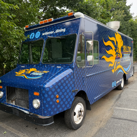 Blue Widener food truck with yellow lions on the side