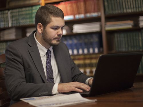 Law Student Studying in Library