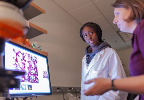Science Student with Professor in Lab