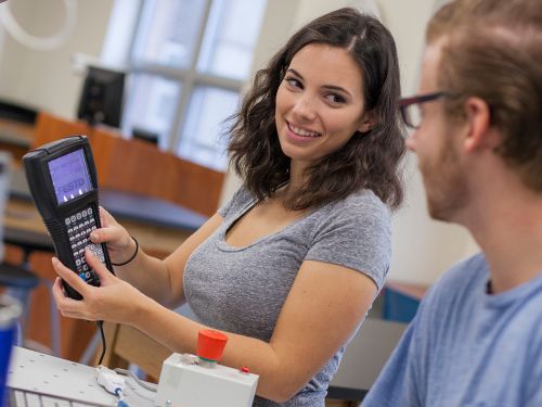 School of Engineering Undergrad Engineering Students Working With Device. Widener University's School of Engineering is one of the top engineering schools in Pennsylvania, offering degrees across many engineering fields.