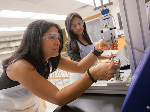 Biomedical engineering student and faculty member conducting a clinical trial