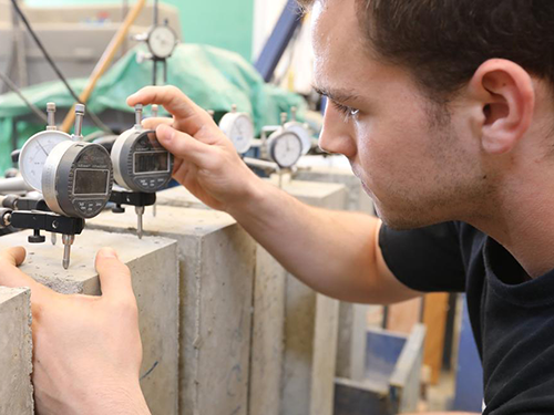 Civil engineering student conducting experiment