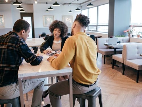 Marketing professionals/students in a group meeting