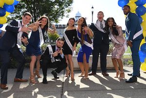 Homecoming court with students