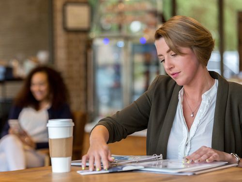 Adult Masters Student Studying in Cafe Coffee Shop 500x375 student studies in cafe with coffee and notebook