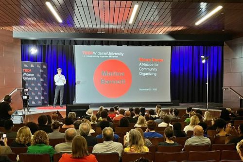 Students, faculty, and staff sit in Alumni Auditorium during the inaugural TEDx Widener University event.