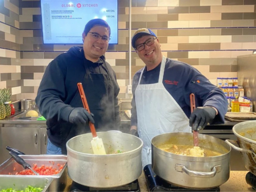 Bryan Lasso Bravo and Chef Matthew Clarke serve in the Pride Cafe