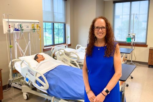 Dean Audrey Snyder poses in a nursing simulation lab.