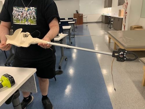 A robotic arm reacher created by a Widener OT student.