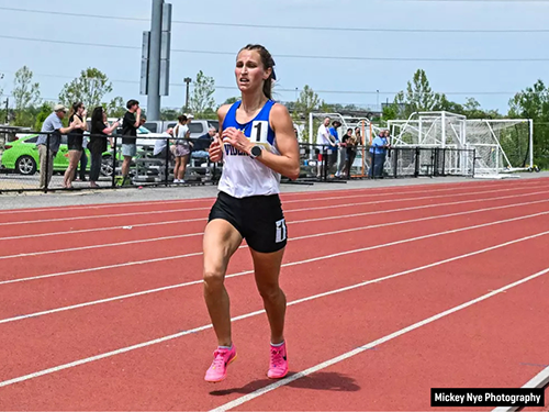Track and field student athlete Gabby Nye running on a track