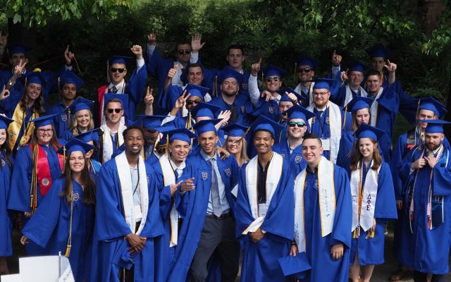 Widener University commencement celebration with students in caps and gowns