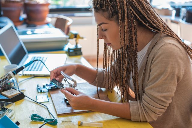Student at home working with engineering kit