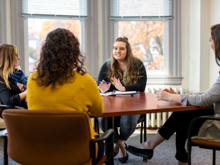 Psychology major Christie Birchall leads group