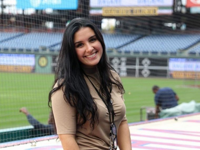 Jessica Feoli sits in the Phillies baseball stadium