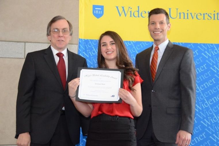 Annamarie Burns holds leadership certificate with two other people