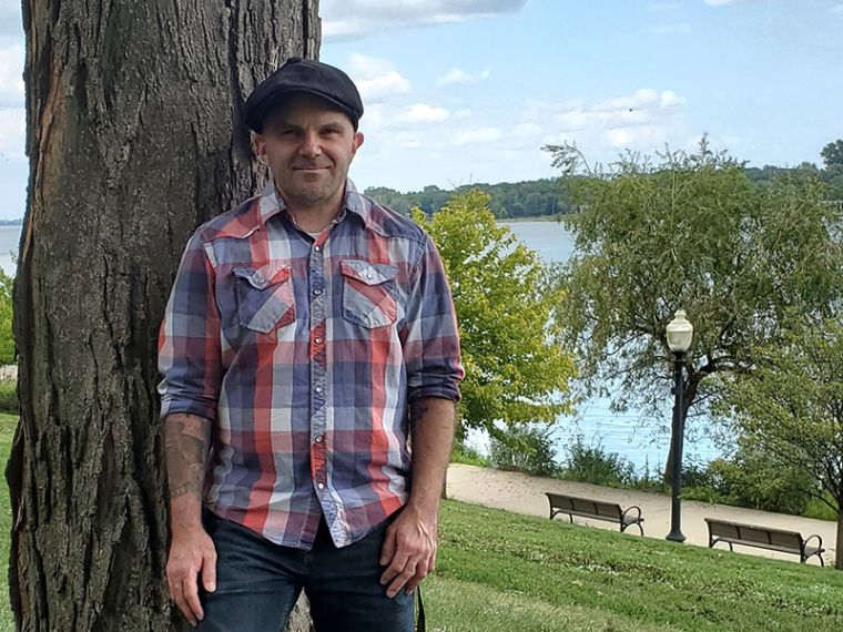 Randy LeBar leaning against a tree