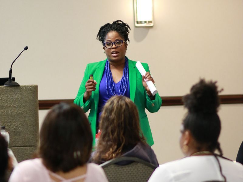Tanya Bass speaks to a conference of sexuality professionals