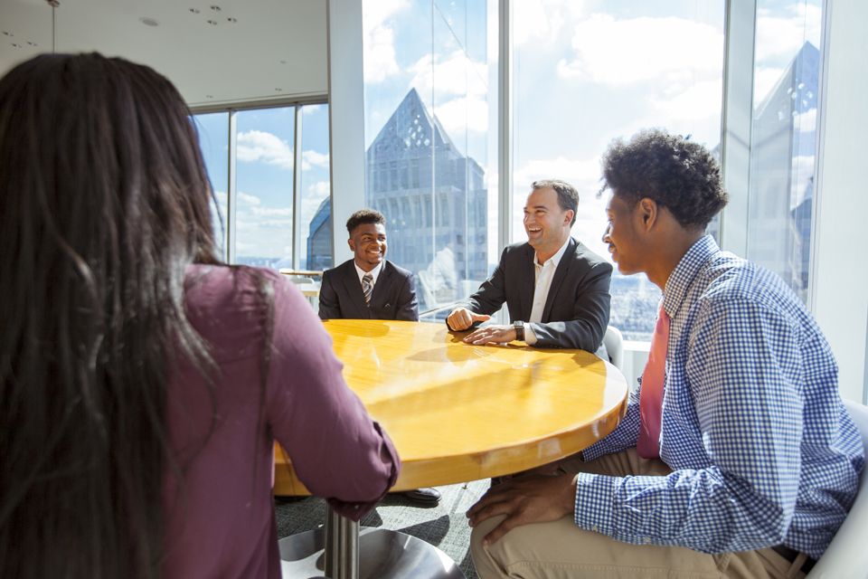students and alum at comcast