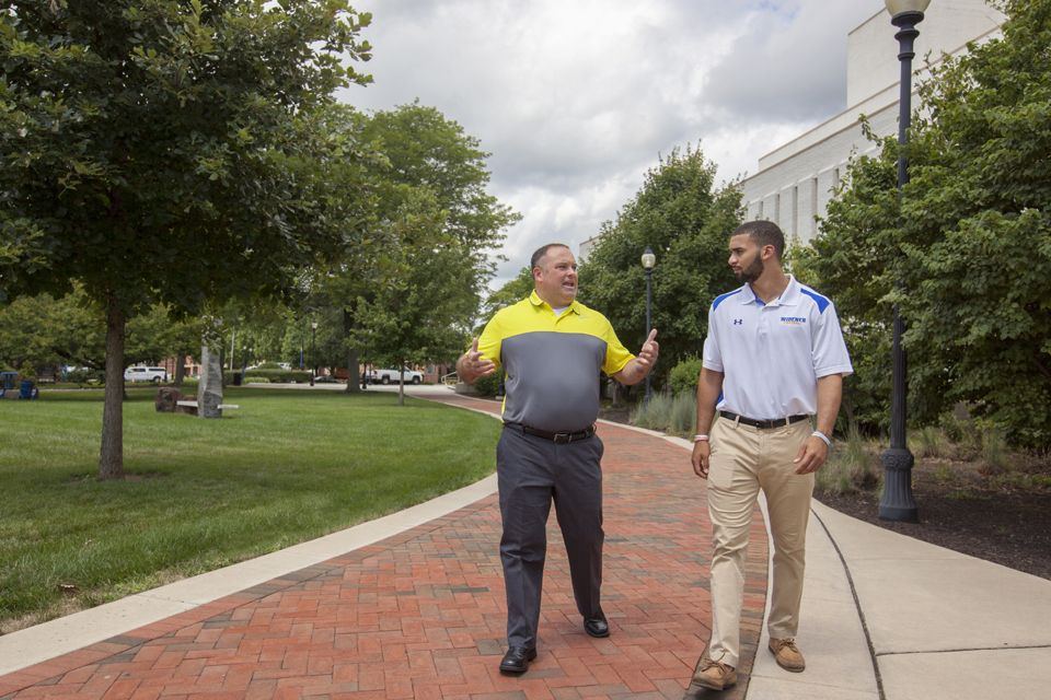 staff and student walking