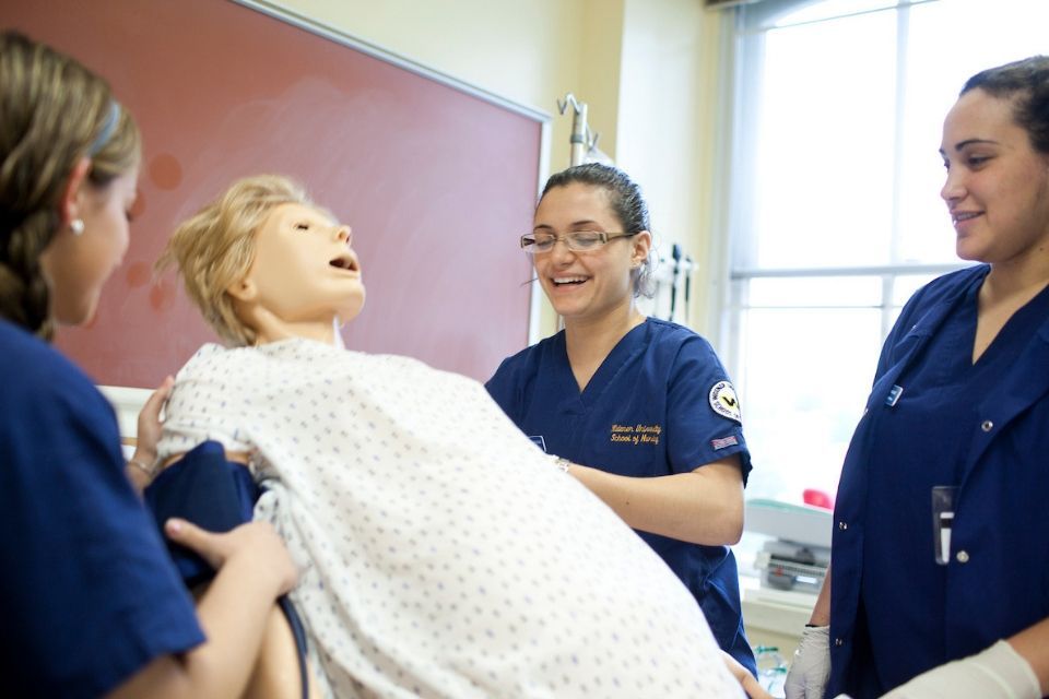 nursing students working in simulation lab