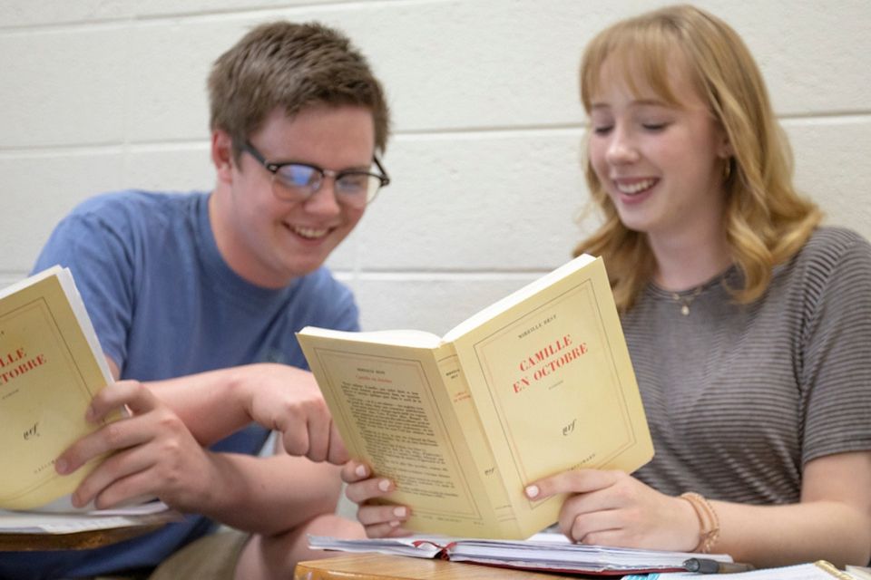students read books in french class
