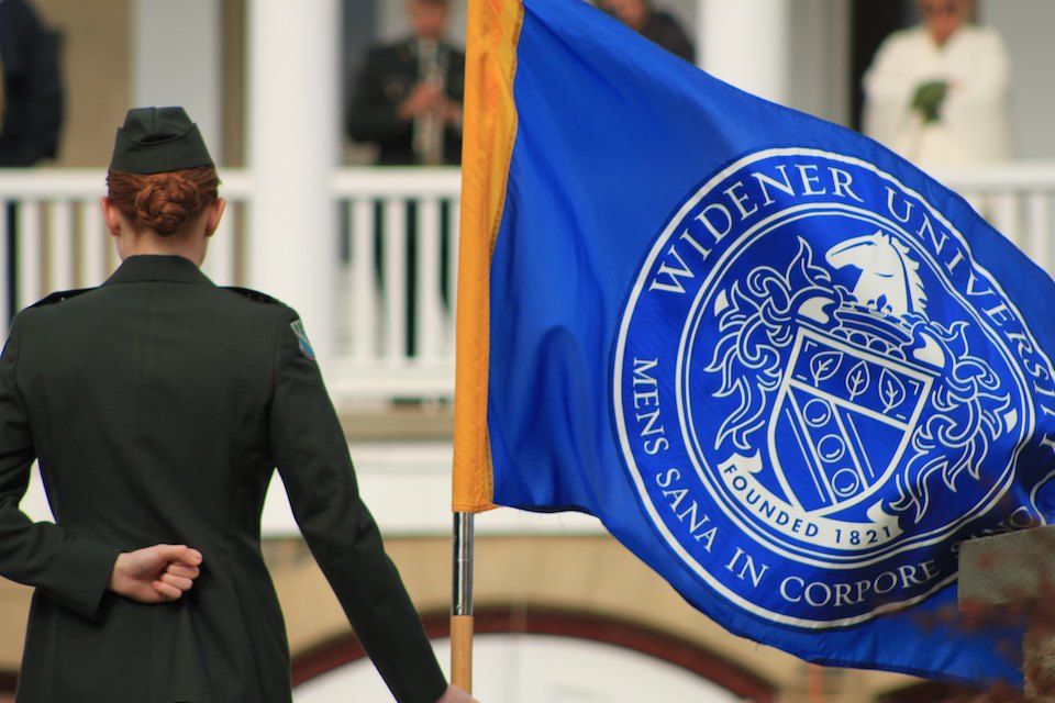 rotc cadets honor veterans day with flag salute